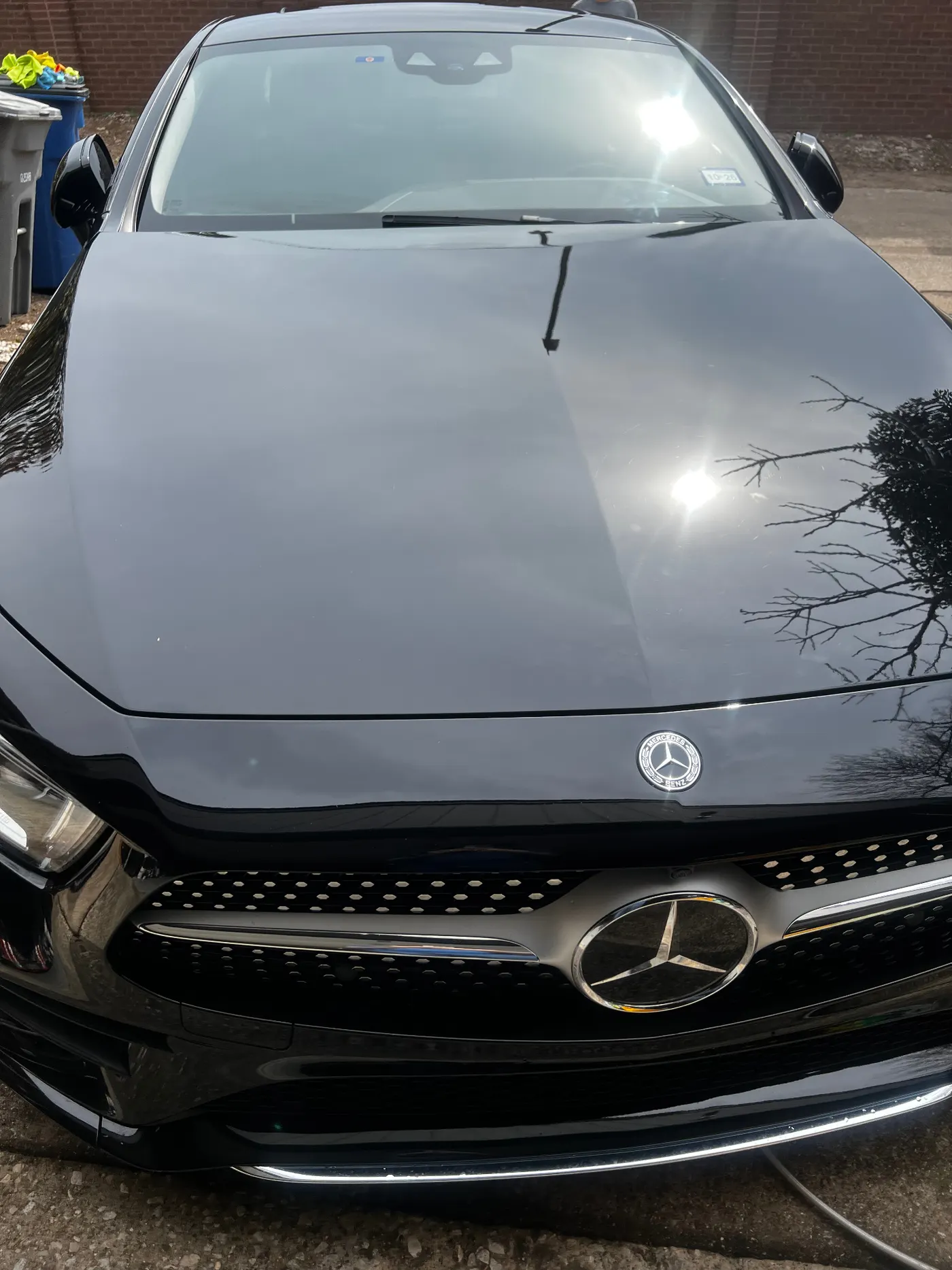 Mercedes-Benz CLS 450 front end with deep gloss hood reflection